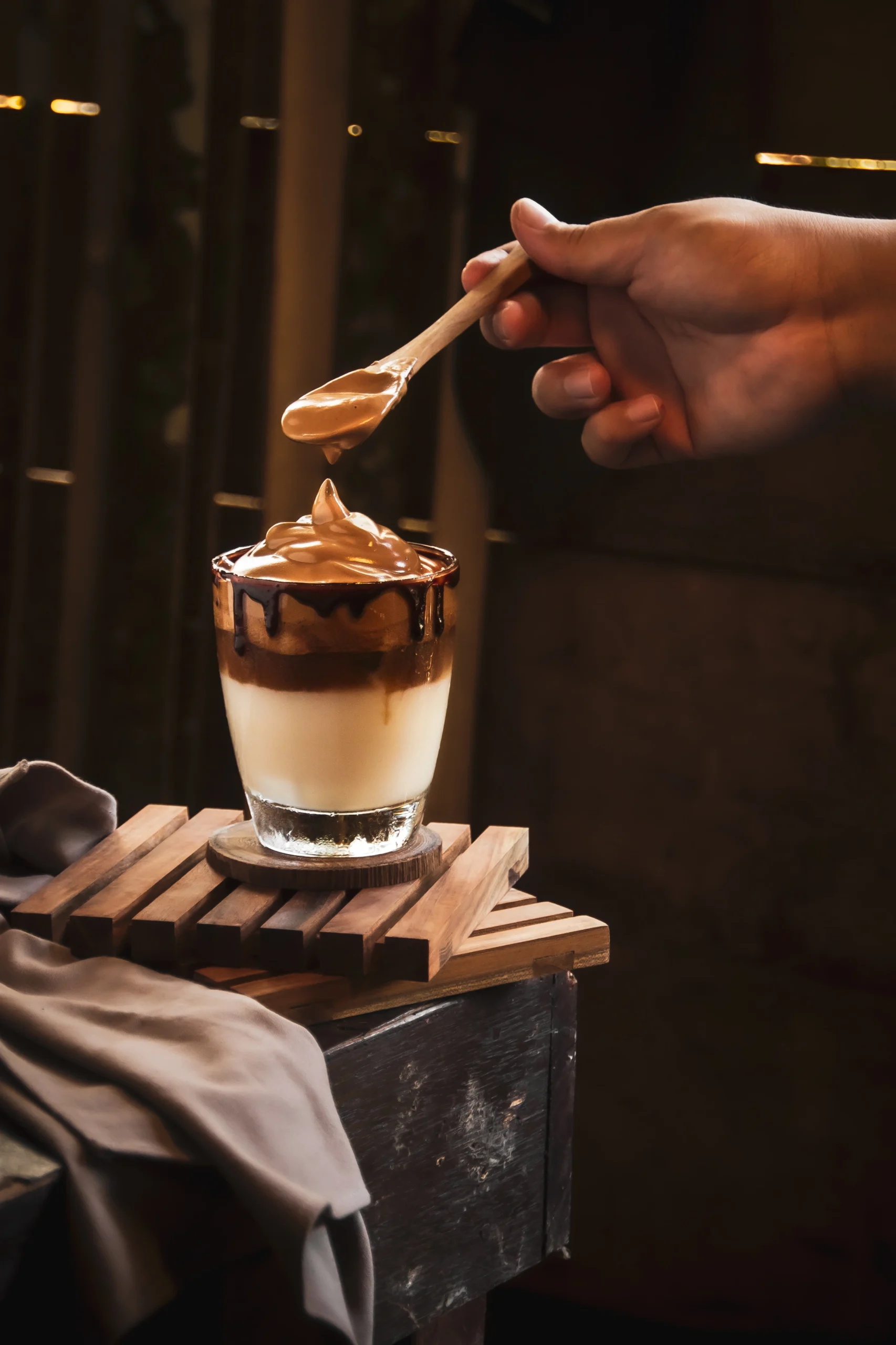 cropped-hand-person-pouring-drink-table